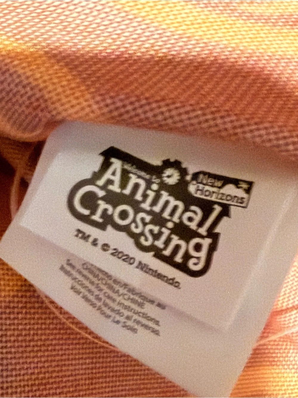 Animal Crossing Drawstring Backpack with Orange Leaf Print and Yellow Badge